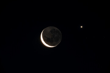 Zoom shot of the moon in conjunction with the planet Venus. astronomical event - Powered by Adobe