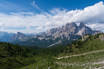 Morning panoramic view of Cima Ambrizzola, Croda da Lago and Le Tofane Gruppe, Dolomites mountains, Italy, in spring meadow