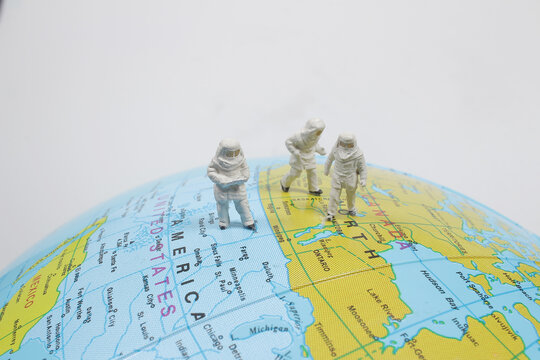 a space Travel concept as a miniature figure onm earth