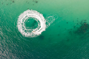 A top view of a circular wave from jet ski at the sea