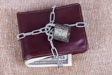 wallet with money in chains