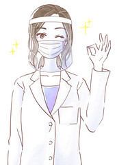 白衣を着てフェイスシールドとマスクを付けてOKポーズの若い女性