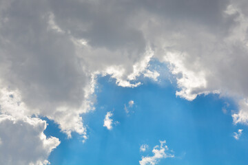 Snow-white clouds against a blue sky