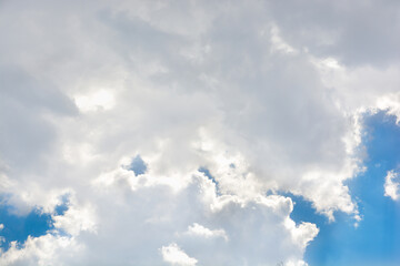 Snow-white clouds against a blue sky