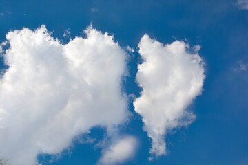 Snow-white clouds against a blue sky