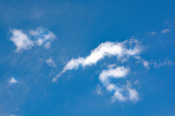 Snow-white clouds against a blue sky