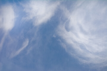 Snow-white clouds against a blue sky