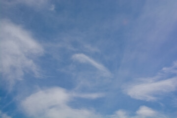 Snow-white clouds against a blue sky