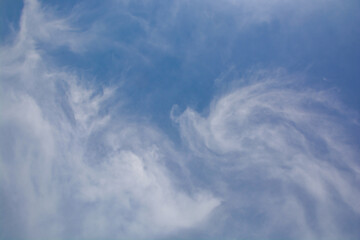 Snow-white clouds against a blue sky