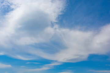 Snow-white clouds against a blue sky