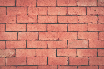 Old grunge orange brick background.