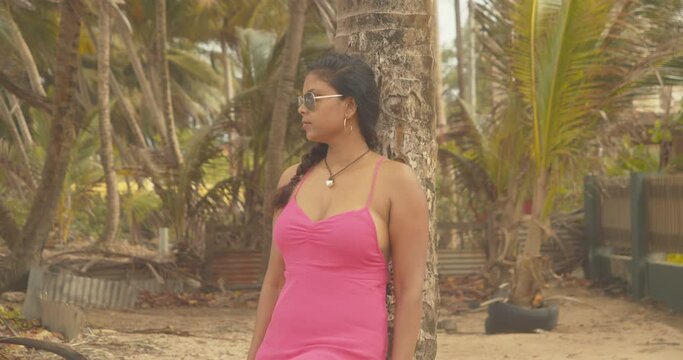 A Caribbean east indian model enjoying the beach location on the island of Trinidad