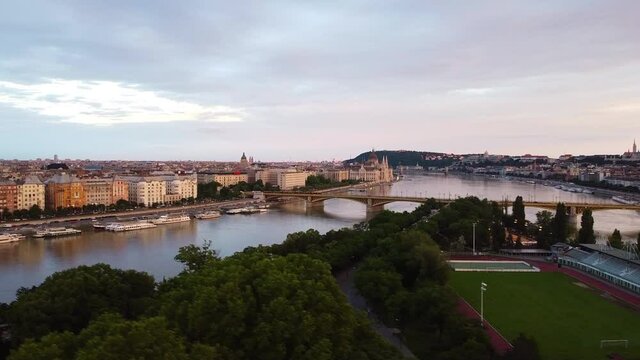 Aerial view showing budapest soccer field on margaret island and hungarian parliament building