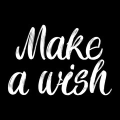 Make a wish brush paint hand drawn lettering on black background. Design templates for greeting cards, overlays, posters