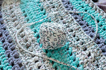 Colored rope for knitting on the background of the finished product