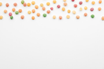 Close up of colorful fruit caramel, hard sugar candies or boiled sweets isolated on white background. Confectionery and food concept..