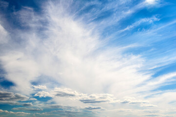 Naklejka na ściany i meble Beautiful white clouds against the background of the sky