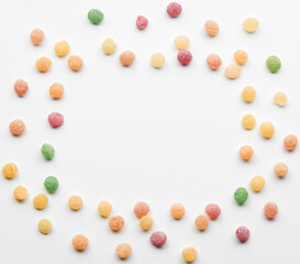 Close up of colorful fruit caramel, hard sugar candies or boiled sweets isolated on white background. Confectionery and food concept.