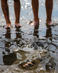 children's feet at the beach