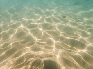 White sand underwater landscape coastal beach in the Mediterranean Sea with water waves pattern light