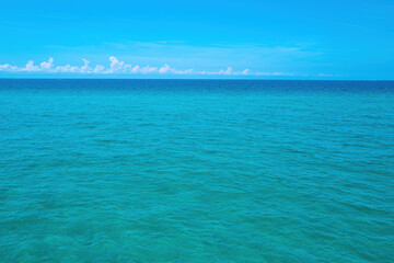 Fototapeta na wymiar Ocean blue Background. panorama. Tropical ocean and beach. Vacation travel background. Summer vacation travel holiday background concept.