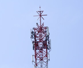 Small Cell 3G, 4G, 5G System. Macro Base Station or Base Transceiver Station. Wireless Communication Antenna Transmitter  tower against blue sky background.