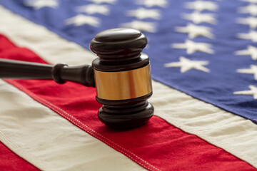 Justice in USA. Law gavel on United States of America flag.