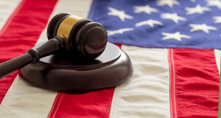 Justice in USA. Law gavel on United States of America flag.