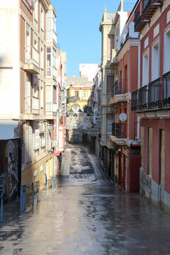 narrow street in the old town of Cartagena after the rain, Spain