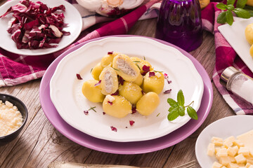 Potato gnocchi stuffed with radicchio and ricotta.	