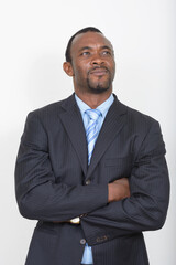 Portrait of handsome bearded African businessman in suit