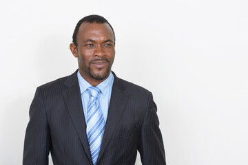 Portrait of handsome bearded African businessman in suit