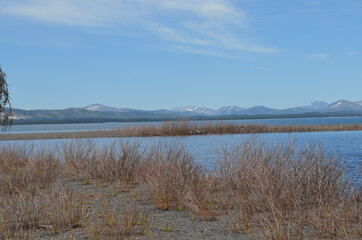 Spring in Yellowstone National Park: Looking Across Yellowstone Lake From Gull Point to Sulphur Hills and Pelican Cone, Saddle Mountain, Castor Peak, Pollux Peak and Pyramid Peak of the Absaroka Range