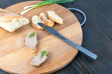 Fresh homemade chicken liver pate on wooden board