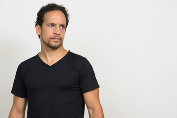 Obraz premium Portrait of handsome bearded Hispanic man with curly hair