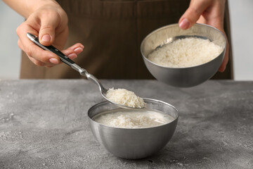 Woman preparing rice water on table