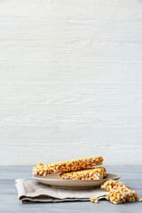 Plate with crispy rice bars on table