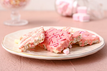 Plate with crispy rice bars on table