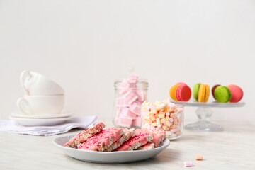 Plate with crispy rice bars on table