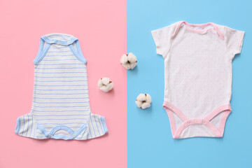 Cotton baby clothes on color background