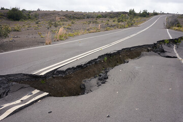 Asphalt road damaged by the volcanic eruption of Kīlauea and caldera collapse with subsequent...