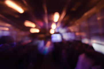 Blurry Light Inside Bus of the Night in Blurry Background.