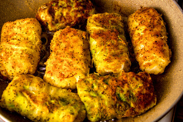 Boiled cabbage rolls covered with breadcrumbs with spices