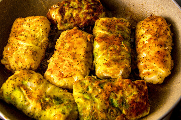 Boiled cabbage rolls covered with breadcrumbs with spices