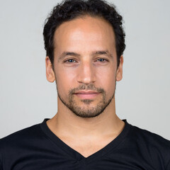 Obraz premium Portrait of handsome bearded Hispanic man with curly hair