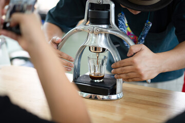 Barista use manual process to make espresso with classic espresso machine
