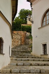 Fototapeta na wymiar Historical narrow street with stairs located near the center of Mikulov in the district of Breclav, region of Morava, Czechia, middle Europe 