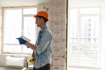 Handyman with a tool belt. House renovation service.