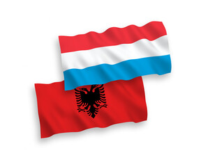 Flags of Albania and Luxembourg on a white background