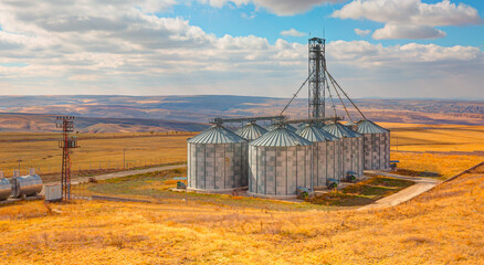 Agricultural Silos for storage and drying of grains, wheat, corn, soy, sunflower. © muratart